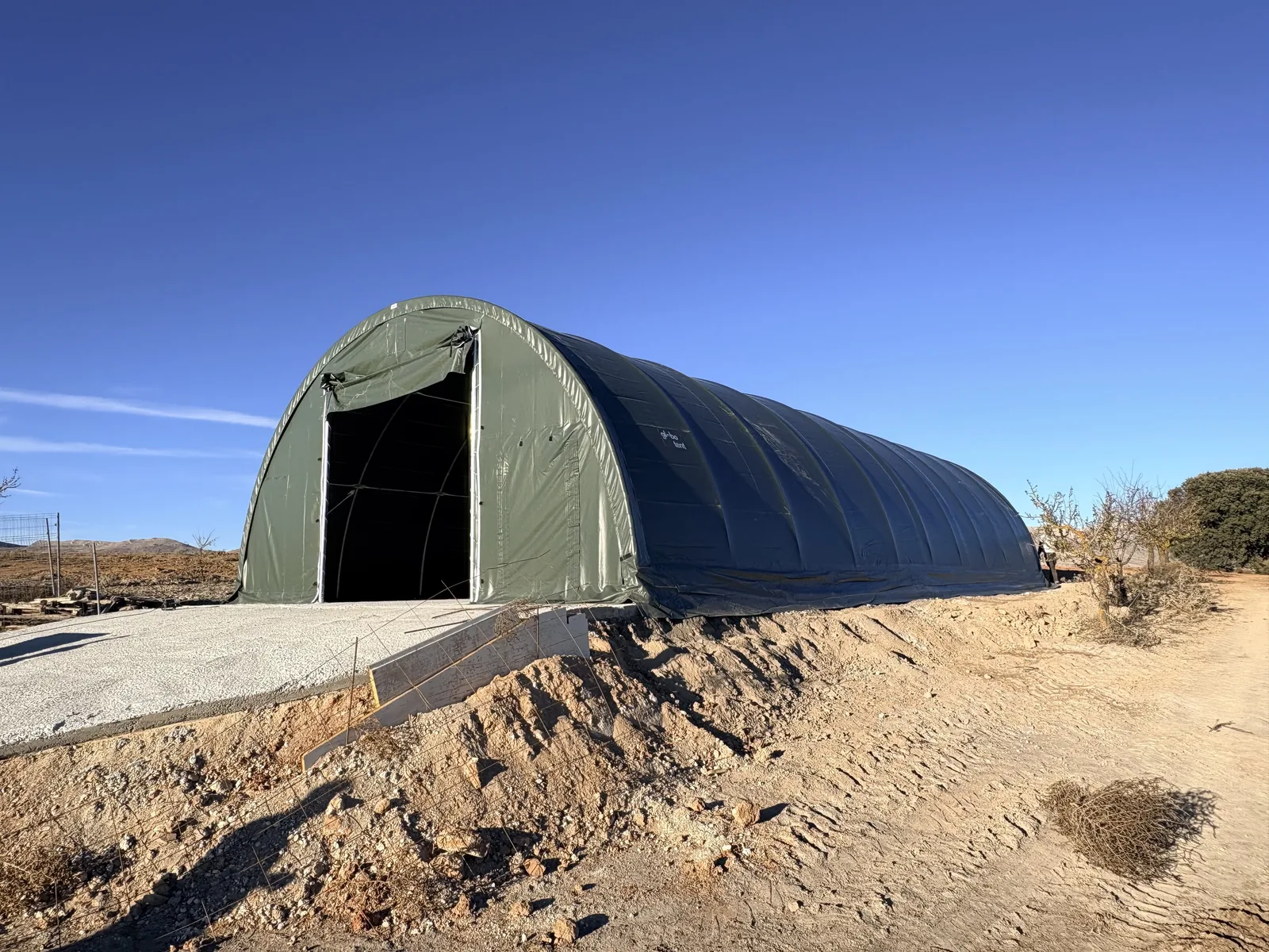 Site with installed Globotent arched shelter
