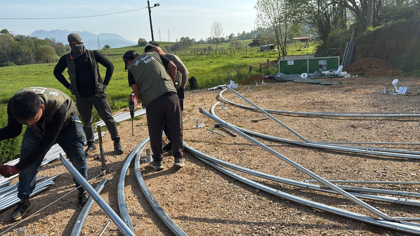 Team laying the steel arches for a new building