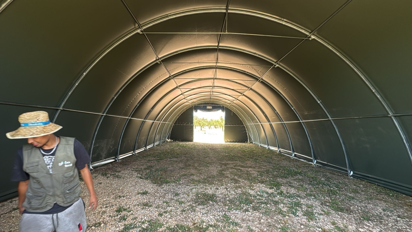 Employee inside a finished clear-span Globotent building